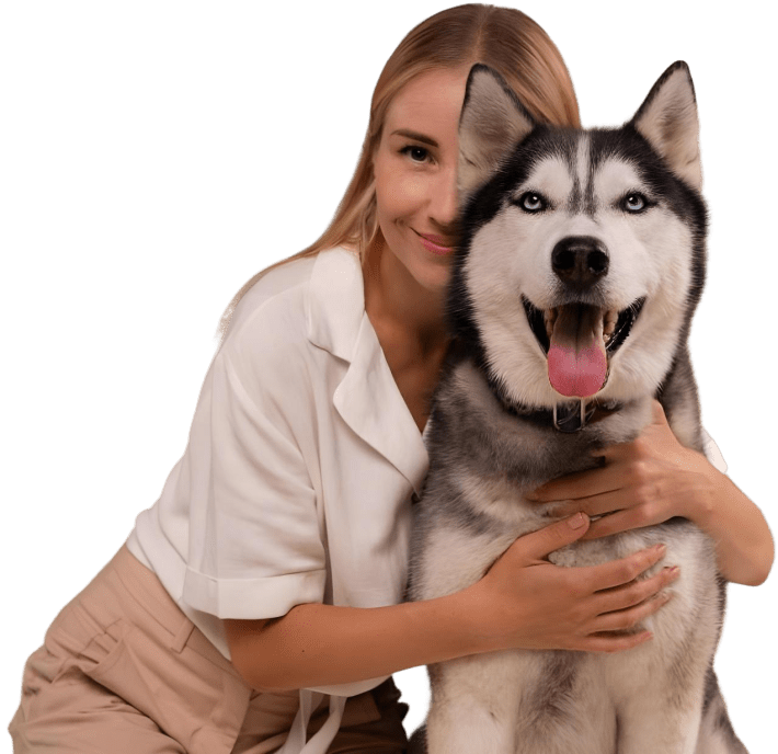 Woman hugging husky